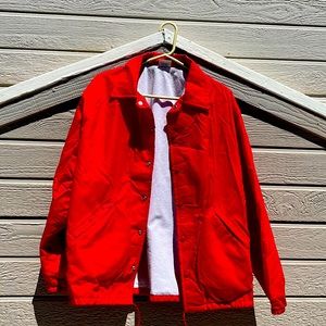 Red large windbreaker brand is bridie by Richard Leslie